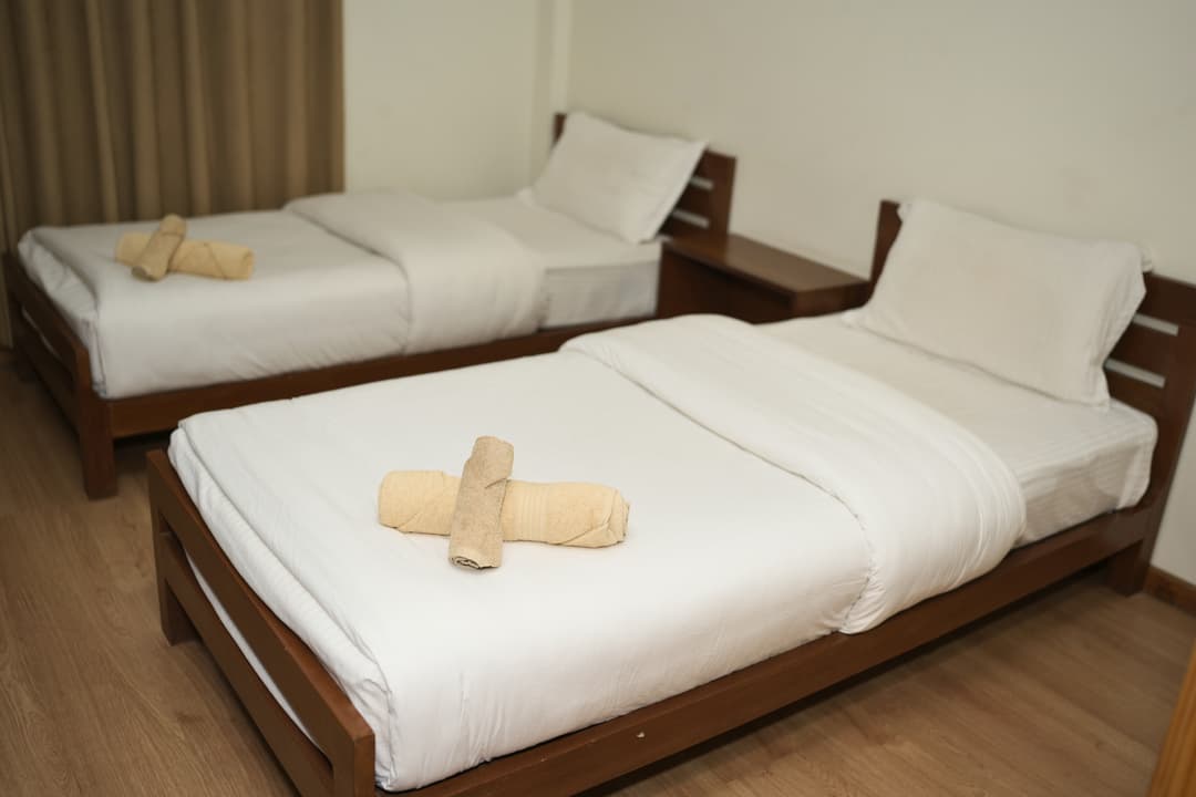 Twin room with common bathroom image 4